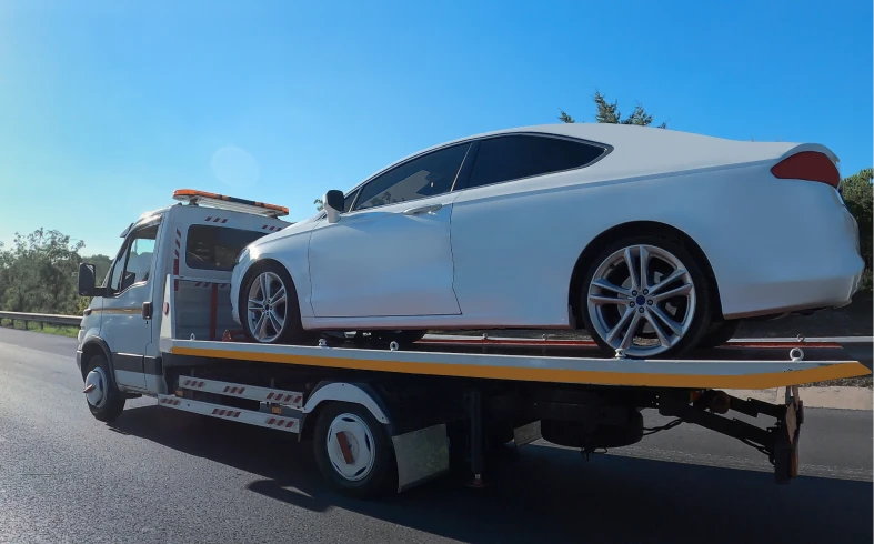 Vehicle being transported on highway tow truck